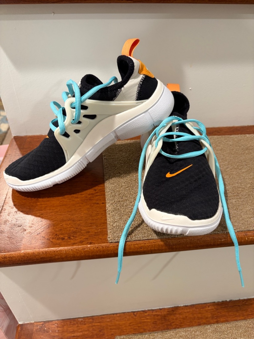 Nike Black Sneakers with Turquoise Laces and Orange Accents